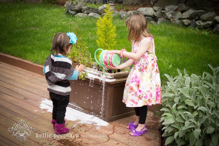 girls watering plants with bubbles