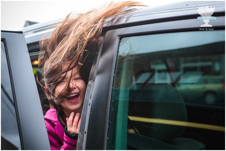 girl with windblown hair in a windstorm